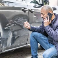 Men-with-a-Damaged-Car.jpg